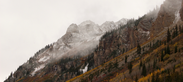 Photo of a mountain with low hanging clouds