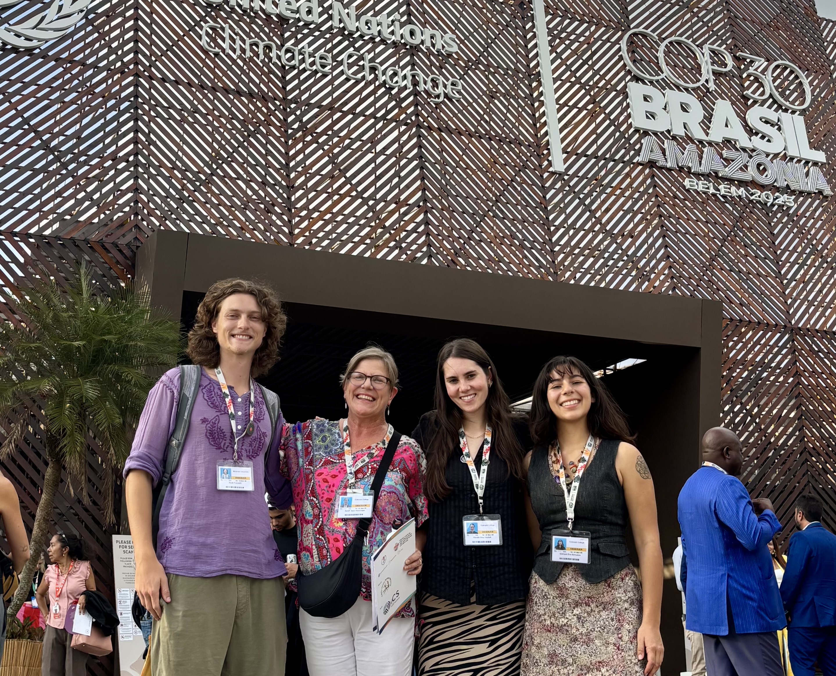 The Colorado College delegation to COP30: Noah Furuseth, Professor Sarah Hautzinger, Havalin Haskell, and Riss Banuelos, outside the venue in Belèm, Brazil.  