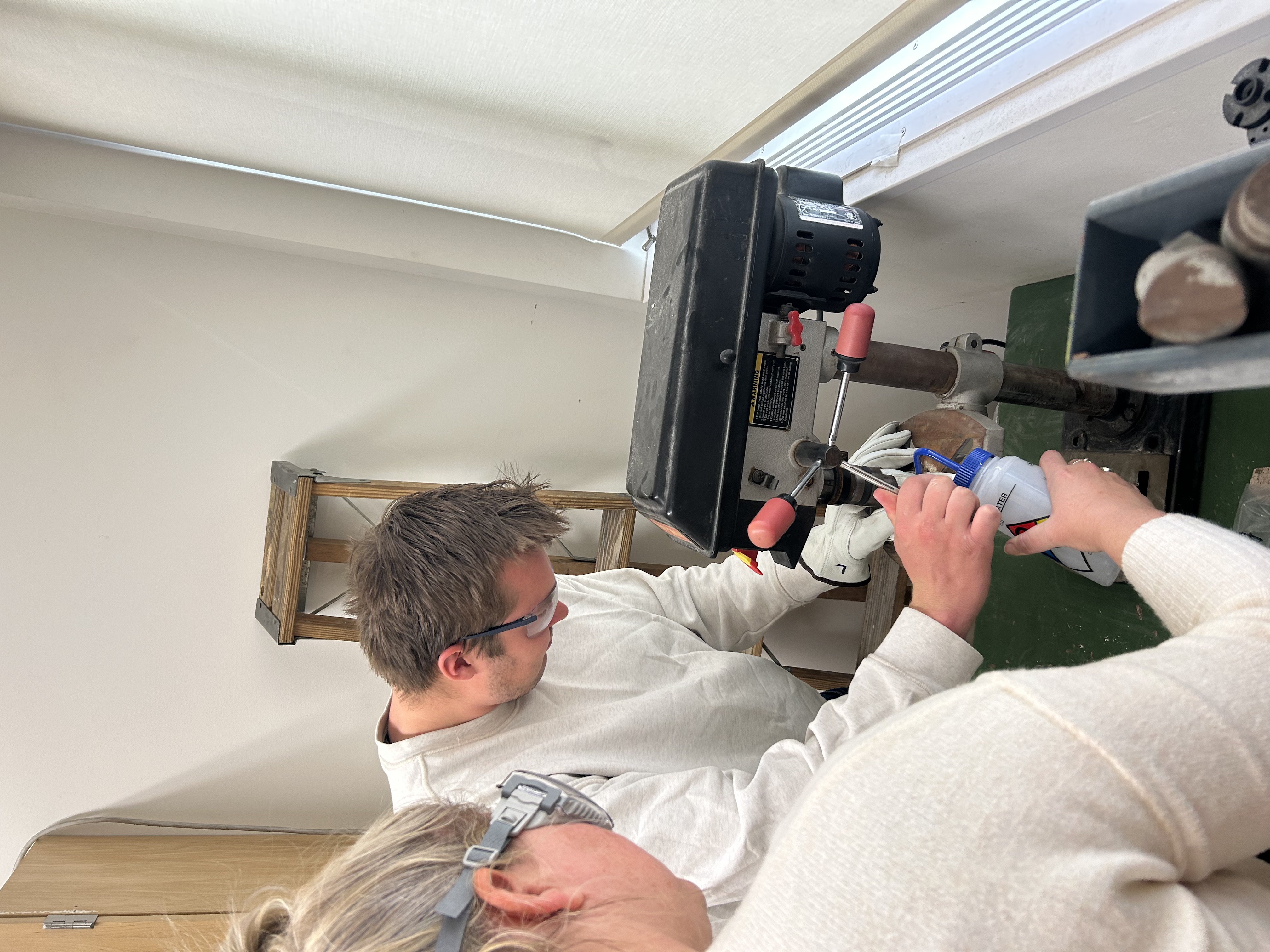 Dr. Michelle Gevedon helping undergraduate student researcher, Anders Swanson, core garnet minerals for isotopic analyses