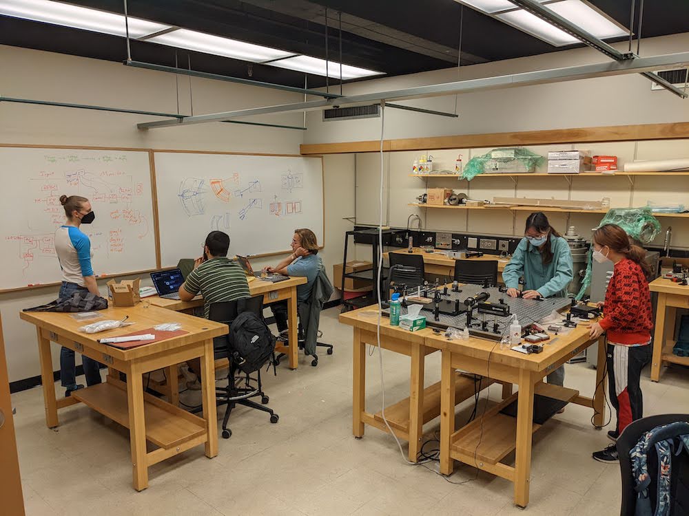 Students working on plasma research with physics professor Adam Light 