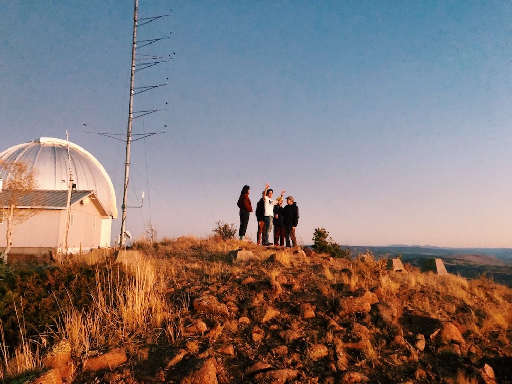 Sunset over some physics students on a field trip to an observatory. <span class="cc-gallery-credit">[Kate Carlton]</span>