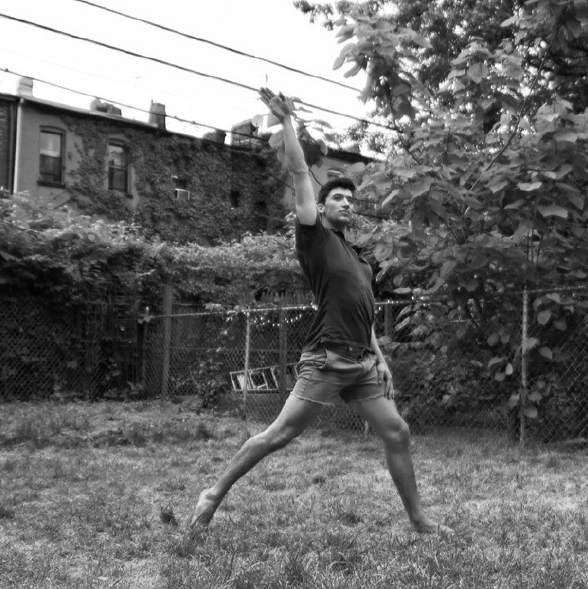 Portrait of Adam Dickerson, Colorado College alumnus and dance instructor, standing outdoors.