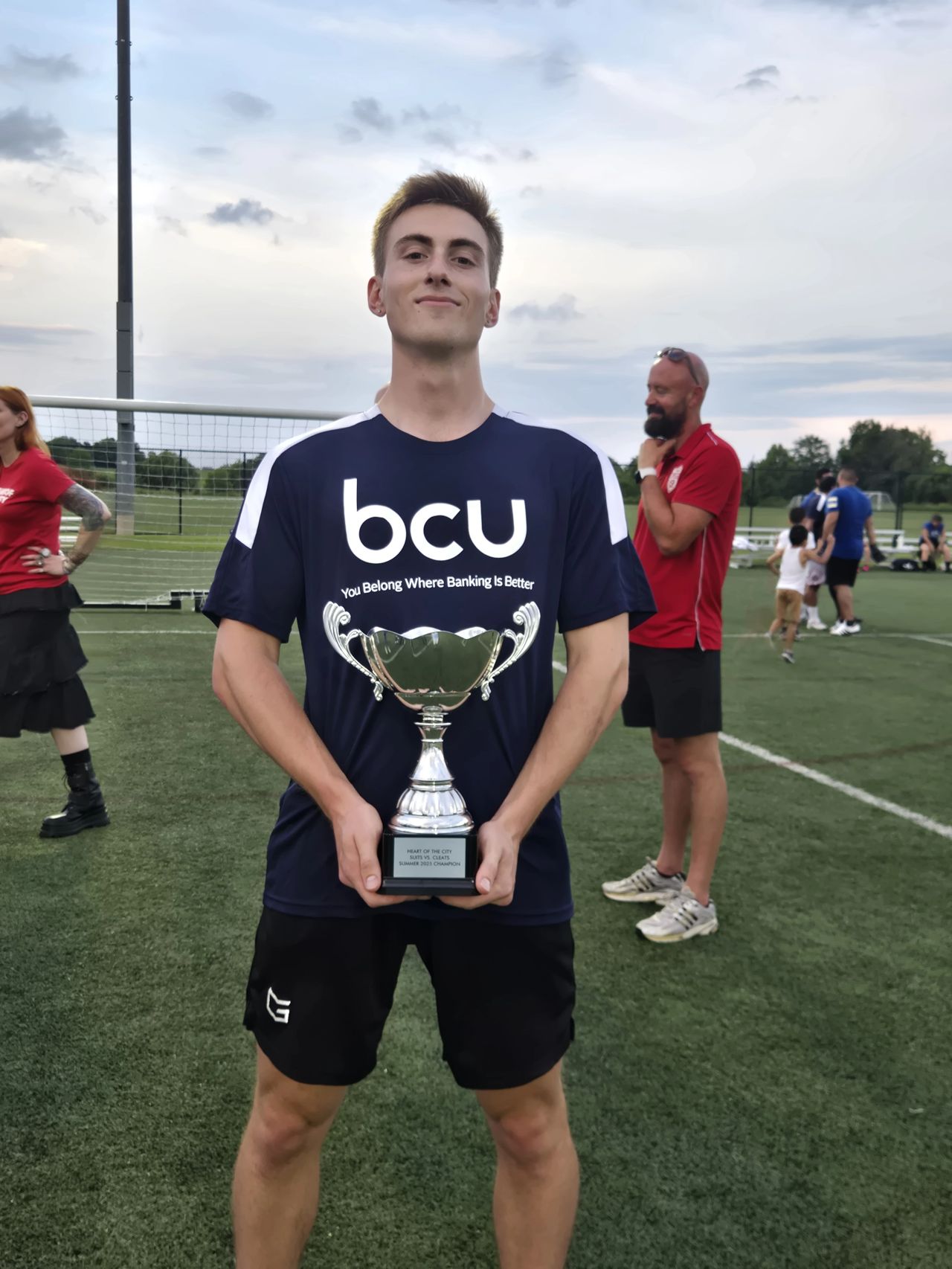 As an intern on the Corporate Relations and Business Development team at Baxter Credit Union, Jack Saccaro ’26 supported different community events designed to engage company partners and the community, such as leading educational sessions and playing in community sports tournaments. Saccaro is pictured holding a trophy after his team won one of the games.  Photo taken in July 2025 after and provided by Saccaro.