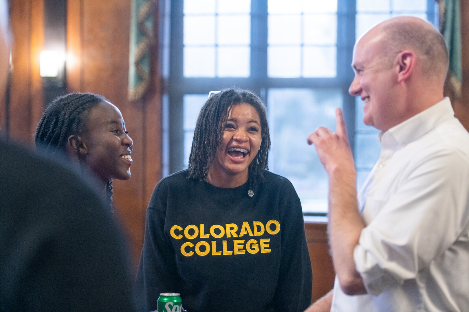 Summer Programs Director Jim Burke takes a moment to congratulate two Stroud Scholars. Four have committed to enroll with CC.  Photo by Lonnie Timmons III