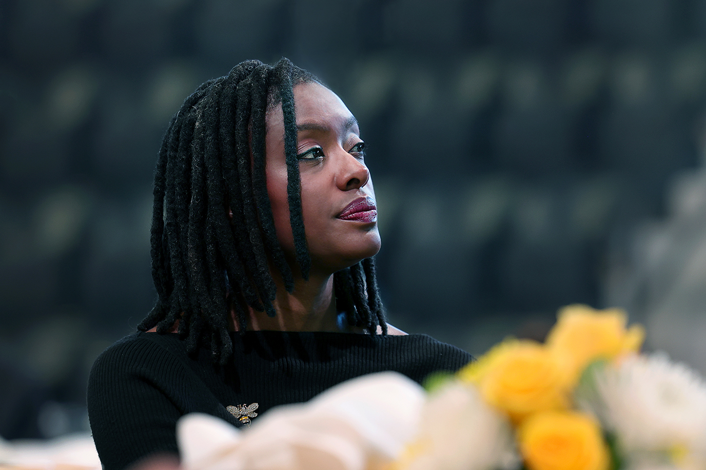 President Manya Whitaker listens to her former students share praise and accolades of their former professor on a video shown during the Inauguration Ceremony. Photo by Jamie Cotten / Colorado College