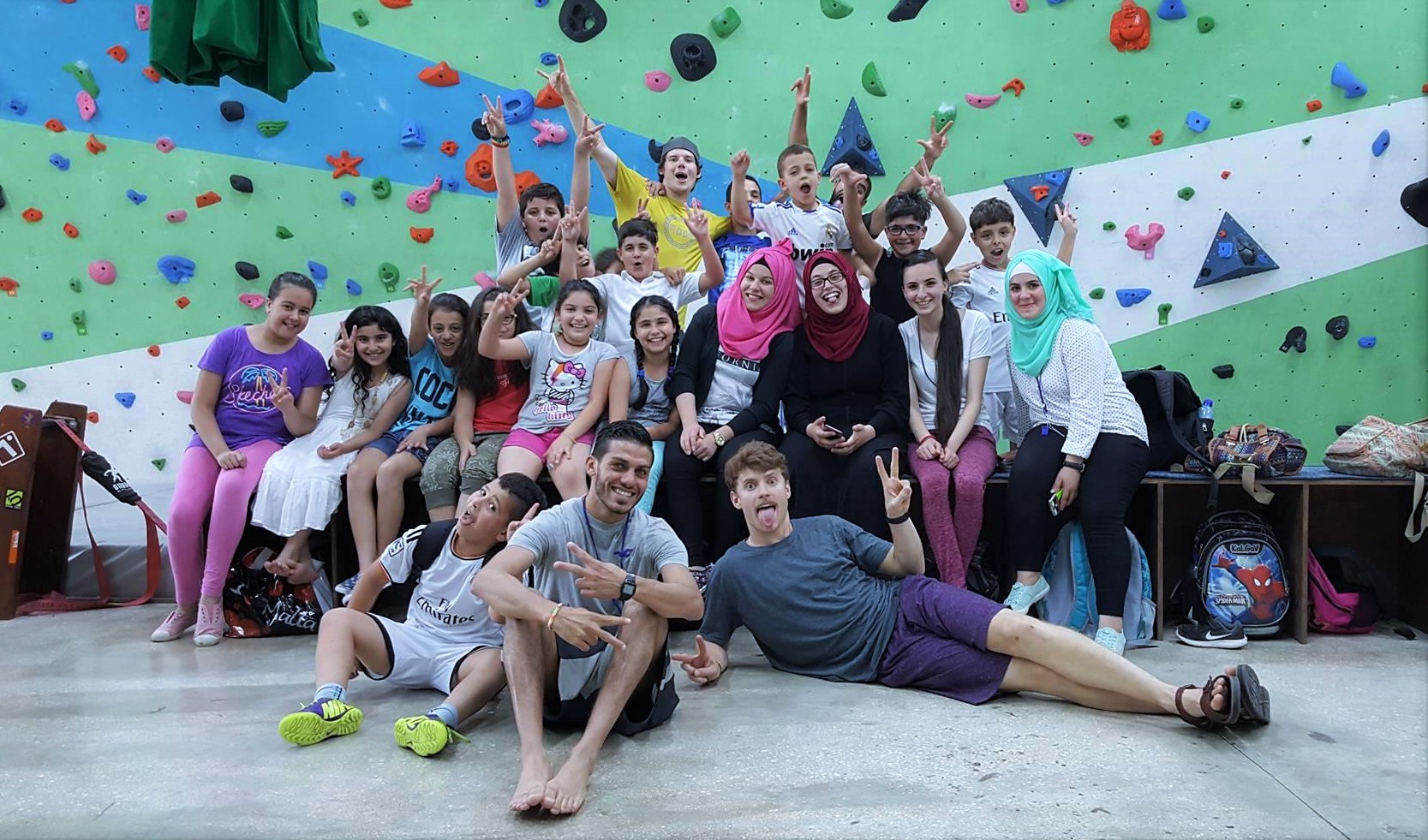 Bruns, Harris with a group of young climbers in the Wadi Climbing Gym they founded in Palestine.