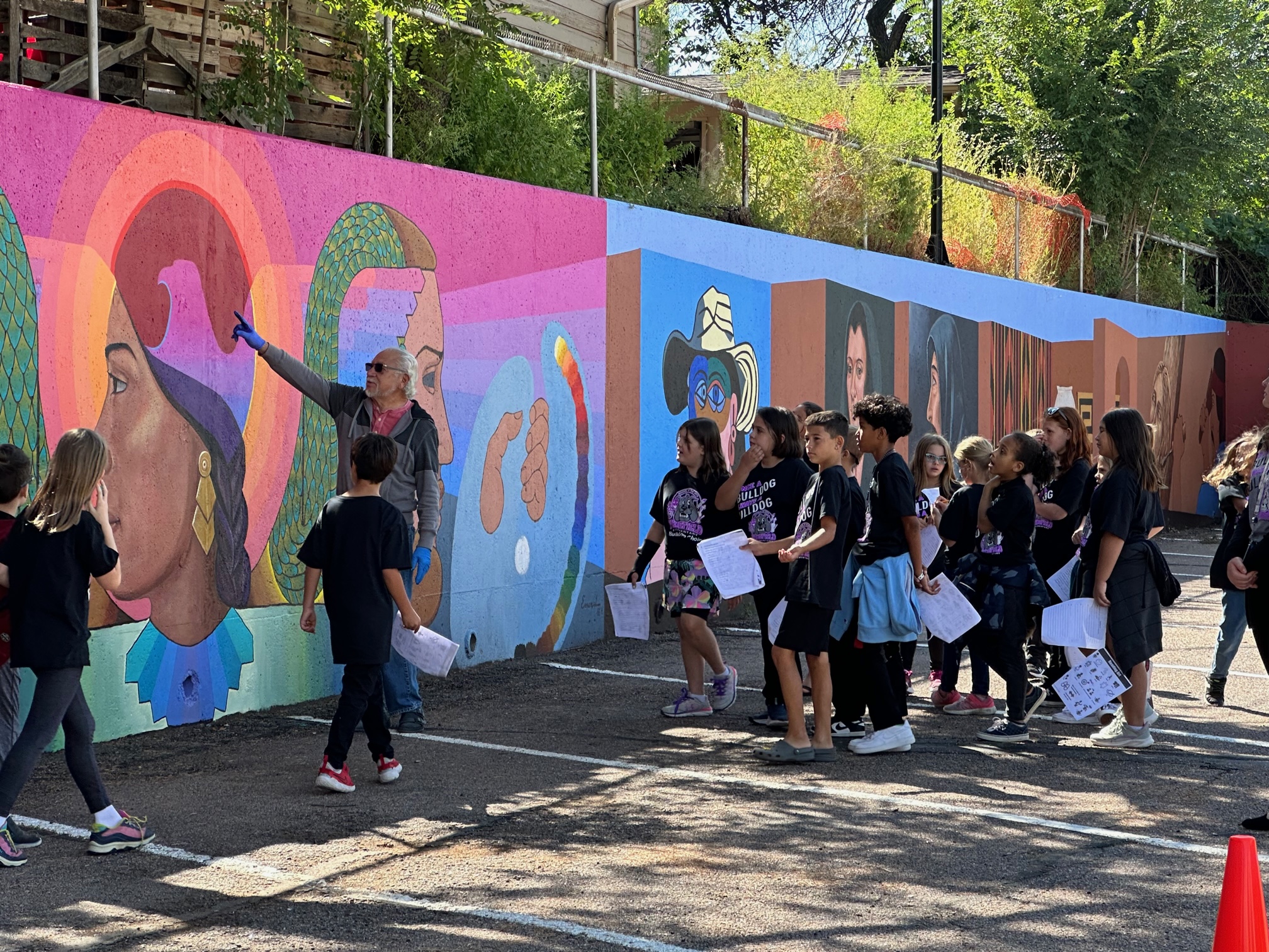 Fourth graders from Widefield Elementary School of the Arts learn how to "read" art with muralist Emanuel Martinez at the restored Arte Mestiza.  Photo by Alexa Gromko / Colorado College