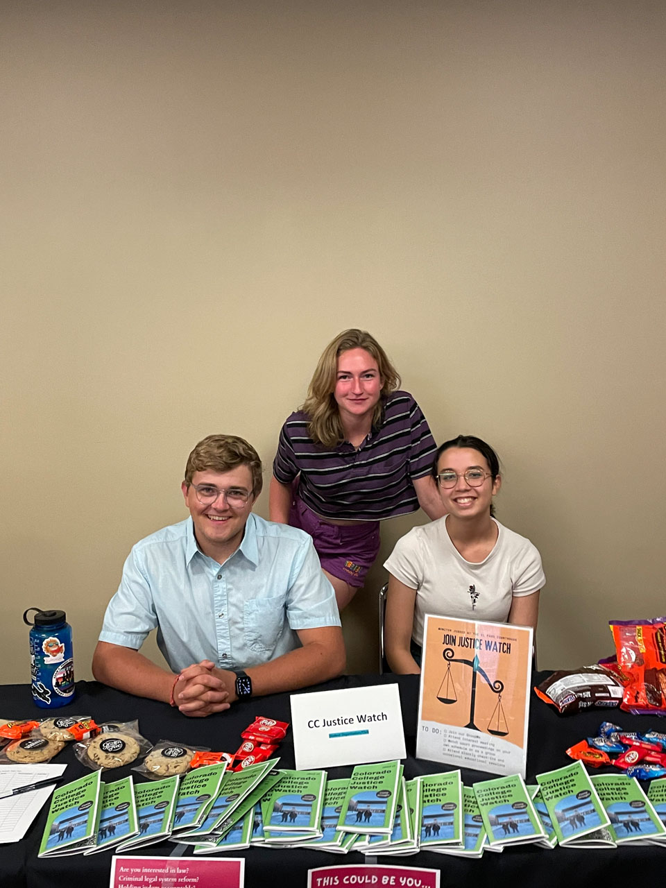 Koray Gates '25,  Emma Fowkes '24, and Isabelle Wangevoord ’25 are pictured on Sept. 1, 2022, promoting the Justice Watch club during the Fall Club Fair.  Photo submitted by Koray Gates '25.