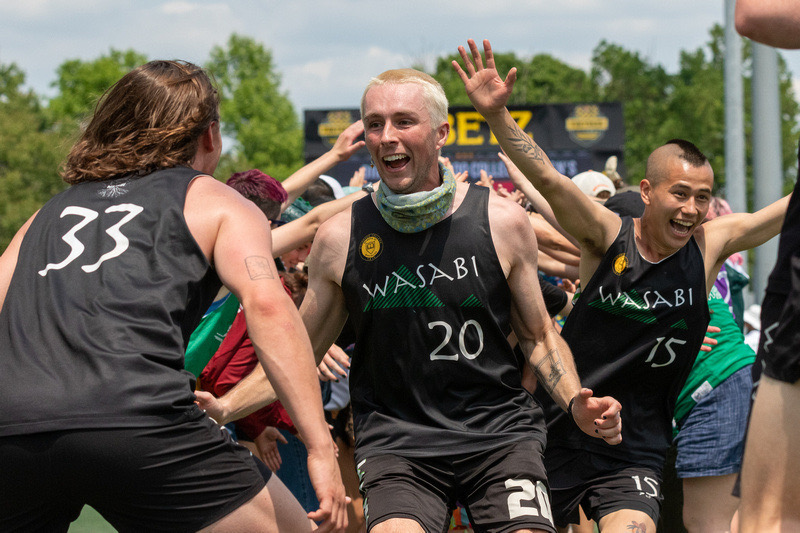 Ben Carpenter '23, Quinn Eaheart '23, and Daon Hatzigiannis '25 celebrate after winning the D-III National Championships in May 2023. Photo submitted by Wasabi Ultimate.
