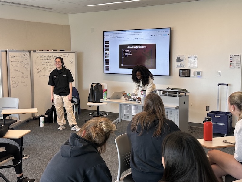 students presenting a diversity training to their peers. 