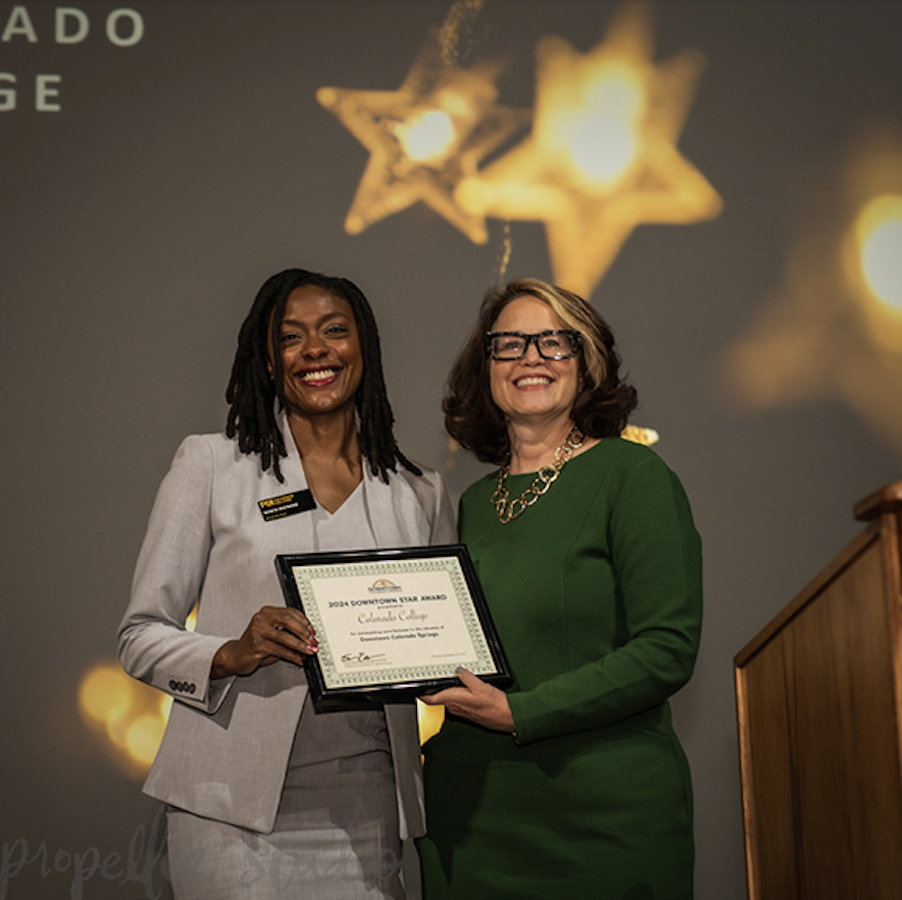 Manya poses with the Downtown Star Award for CC.