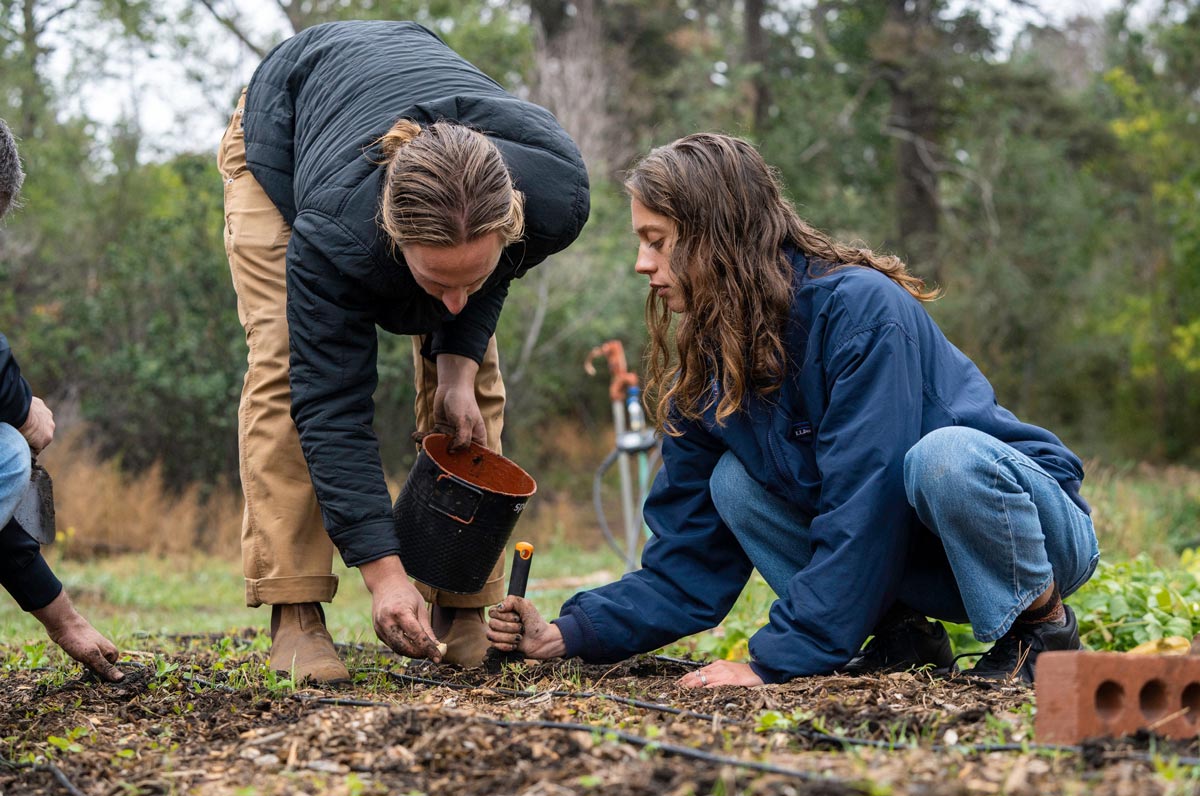 Students working outdoors representing sustainability