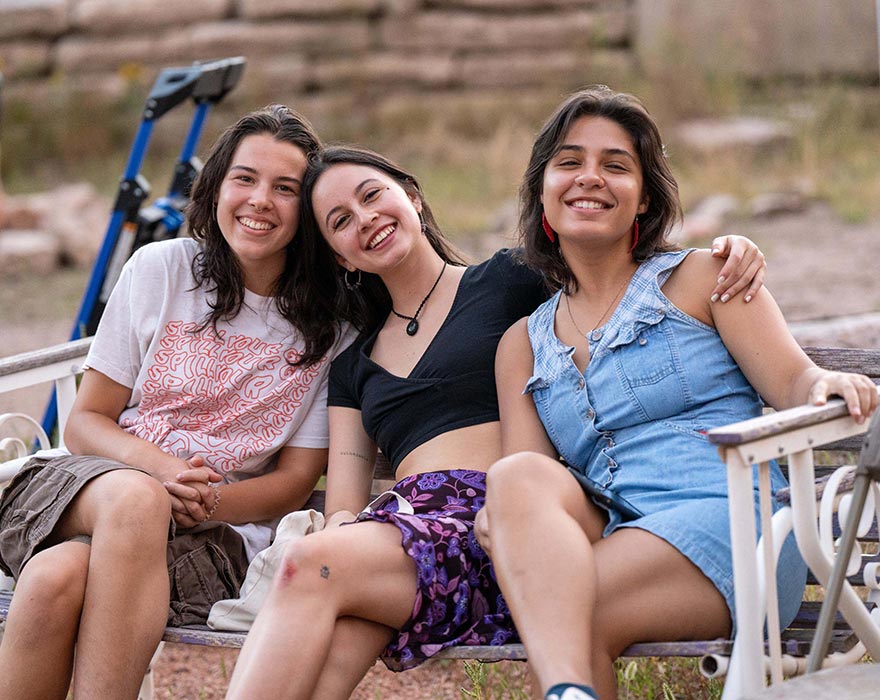 CC students sitting on bench
